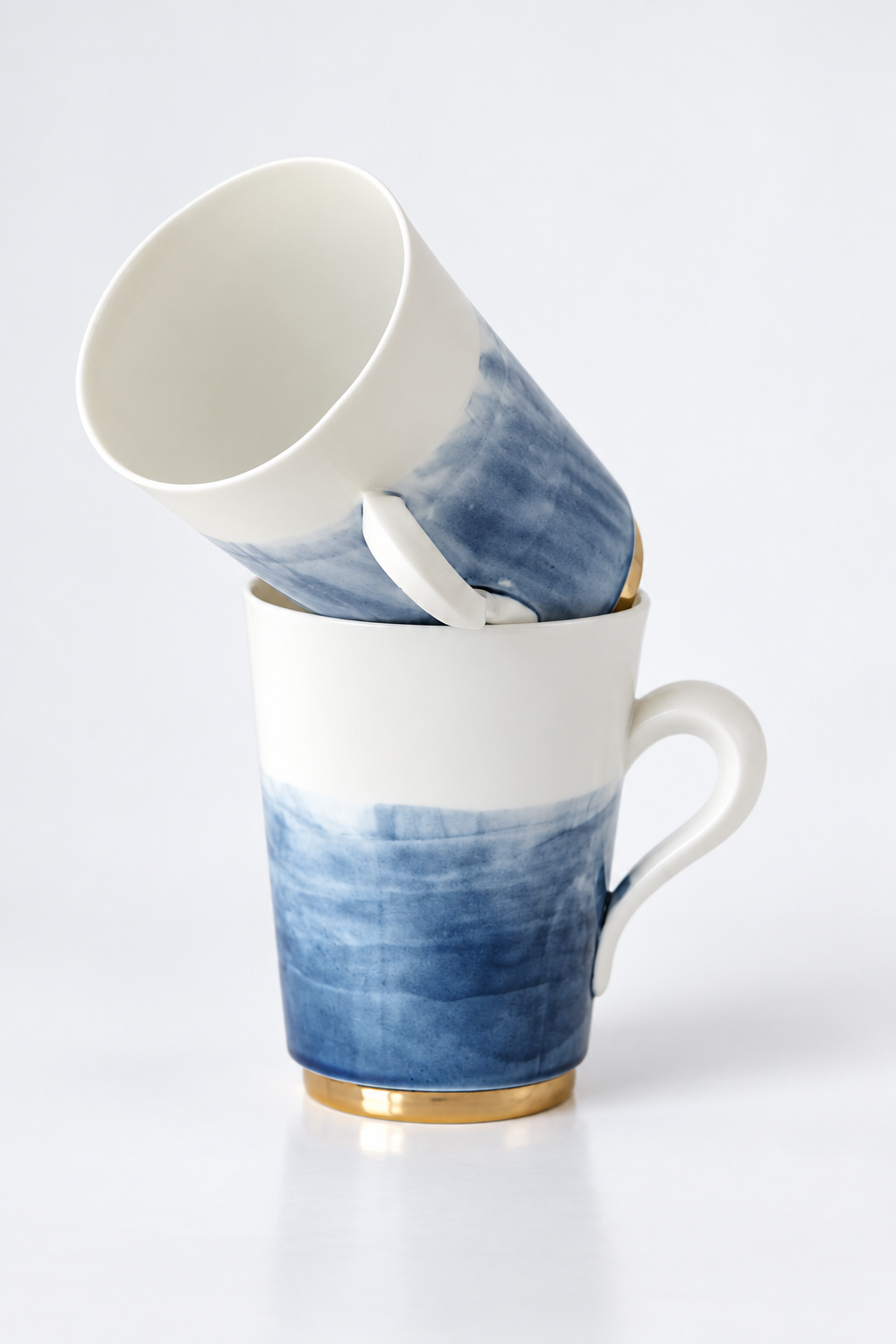 Two blue and white porcelain beakers